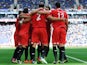 Sevilla's Federico Fazio is congratulated by teammates after scoring the opening goal against Espanyol on November 10, 2013