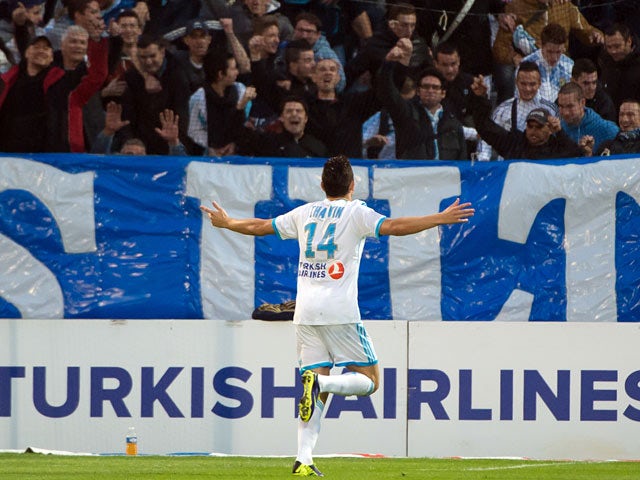 Marseille's Florian Thauvin celebrates after scoring the opening goal against Sochaux on November 10, 2013