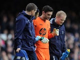 Hugo Lloris of Tottenham Hotspur leaves the field through injury during the Barclays Premier League match between Everton and Tottenham Hotspur at Goodison Park on November 03, 2013