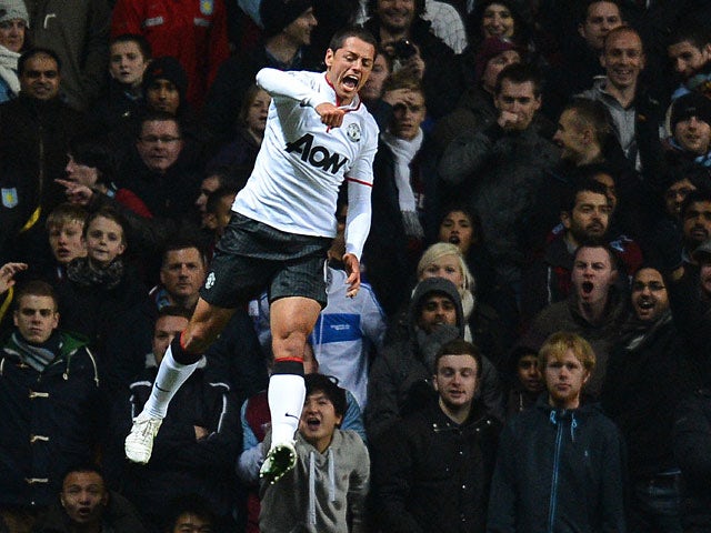 Man United's Javier Hernandez celebrates after scoring his second goal during the match against Aston Villa on November 10, 2012