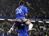 Chelsea's captain John Terry jumps into the arms of team-mate Frank Lampard after scoring during the English Premier League footbal match between Chelsea and Manchester United on November 8, 2009
