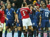 Manchester United and Arsenal players clash during a match at Old Trafford on October 24, 2004.