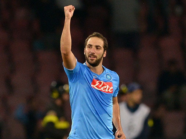 Napoli's Argentinian forward Gonzalo Higuain celebrates scoring a goal during the UEFA Champions League group F football match SSC Napoli vs Olympique de Marseille at the San Paolo Stadium in Naples on November 6, 2013