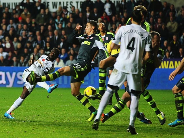 Swansea's Nathan Dyer scores his team's second goal against Stoke on November 10, 2013