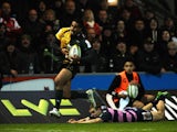Ken Pisi of Northampton Saints runs through a tackle on his way to scoring his second try during the LV= Cup match between Northampton Saints and Gloucester at Franklin's Gardens on November 9, 2013