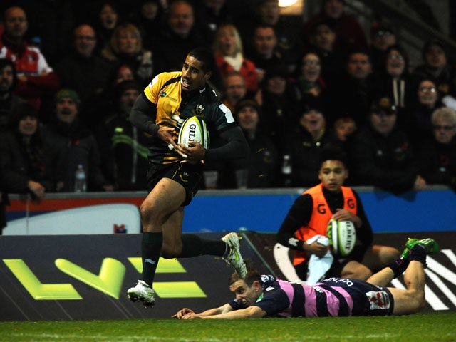 Ken Pisi of Northampton Saints runs through a tackle on his way to scoring his second try during the LV= Cup match between Northampton Saints and Gloucester at Franklin's Gardens on November 9, 2013