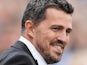 Brighton & Hove Albion manager Oscar Garcia attempts to break into a smile on August 10, 2013