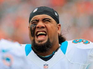 Defensive tackle Paul Soliai #96 of the Miami Dolphins looks on against the New England Patriots at Sun Life Stadium on December 2, 2012