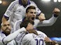 Anderlecht's forward Aleksandar Mitrovic celebrates the goal scored by his teammate Anderlecht's midfielder Demy De Zeeuw during the UEFA Champions League football match Paris Saint-Germain (PSG) vs RSC Anderlecht (RSCA) on November 5, 2013