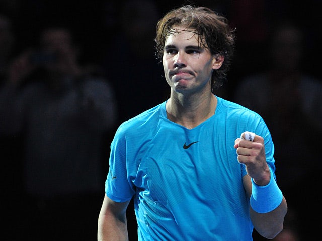 Rafael Nadal celebrates victory over Roger Federer during their semi final match at the ATP World Tour Finals on November 10, 2013