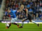 David Templeton of Rangers and Ross Millen of Dunfermline challenge during the Scottish League One match between Rangers and Dunfermline at Ibrox Stadium on November 6, 2013