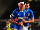 Lee McCulloch of Rangers celebrates with his team-mates after scoring the opening goal from the penalty spot during the Scottish League One match between Rangers and Dunfermline at Ibrox Stadium on November 6, 2013