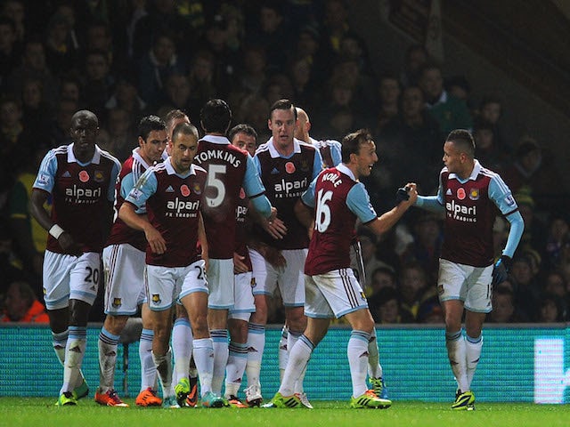 Goalscorer for West Ham United Ravel Morrison celebrates with Mark Noble during the Barclays Premier League match between Norwich City on November 9, 2013