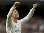 Real Madrid's Portuguese forward Cristiano Ronaldo celebrates after scoring his third goal during the Spanish league football match Real Madrid vs Real Sociedad at the Santiago Bernabeu stadium in Madrid on November 9, 2013