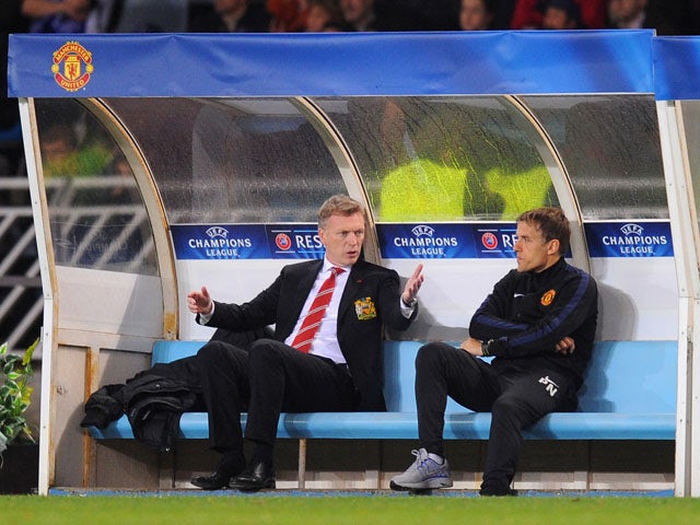 Manchester United manager David Moyes reacts with Phil Neville to the sending off of Marouane Fellainiduring the UEFA Champions League Group A match between Real Sociedad and Manchester United at Estadio Anoeta on November 5, 2013