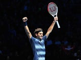Switzerland's Roger Federer celebrates beating Argentina's Juan Martin Del Potro during their group B singles match in the round robin stage on the sixth day of the ATP World Tour Finals tennis tournament in London on November 9, 2013