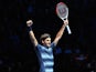 Switzerland's Roger Federer celebrates beating Argentina's Juan Martin Del Potro during their group B singles match in the round robin stage on the sixth day of the ATP World Tour Finals tennis tournament in London on November 9, 2013