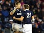 Sean Lamont of Scotland and Henry Pyrgos of Scotland embrace at the end of the match during the International rugby union test match between Scotland and Japan at Murrayfield Stadium in Edinburgh on November 9, 2013