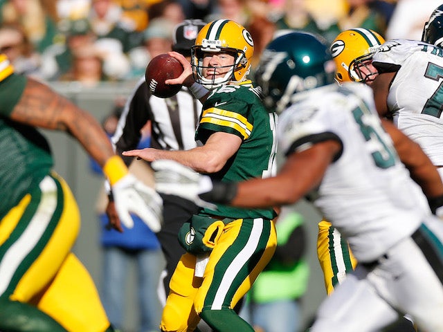 Scott Tolzien of the Green Bay Packers throws a second quarter pass while playing the Philadelphia Eagles at Lambeau Field on November 10, 2013 