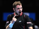 Switzerland's Stanislas Wawrinka celebrates winning a game on the way to beating Spain's David Ferrer during their group A singles match in the round robin stage on the fifth day of the ATP World Tour Finals tennis tournament in London on November 8, 2013