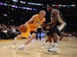 Steve Blake #5 of the Los Angeles Lakers drives to the basket around Derrick Favors #15 of the Utah Jazz in the second half at Staples Center on October 22, 2013