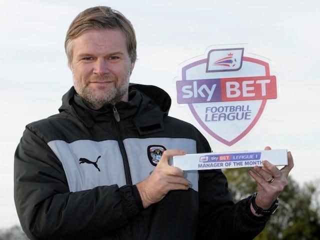 Coventry City manager Steven Pressley celebrates his Manager of the Month award for October on November 7, 2013