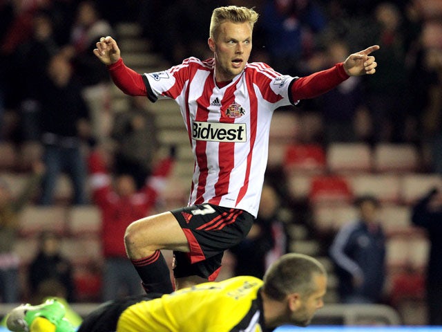 Sunderland's Swedish midfielder Sebastian Larsson celebrates scoring his team's second goal during the English League Cup football match between Sunderland AFC and Southampton FC at the Stadium of Light in Sunderland, northern England, on November 6, 2013