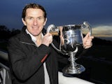 Tony McCoy poses with his trophy marking his 4000th career victory at Towcester racecourse on November 07, 2013