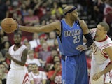 Vince Carter #25 of the Dallas Mavericks keeps the ball away from Francisco Garcia #32 of the Houston Rockets at Toyota Center on November 1, 2013