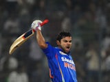 Indian batsman Virat Kholi reacts after scoring a century during the one day international Asia Cup cricket match between India and Pakistan on March 18, 2012
