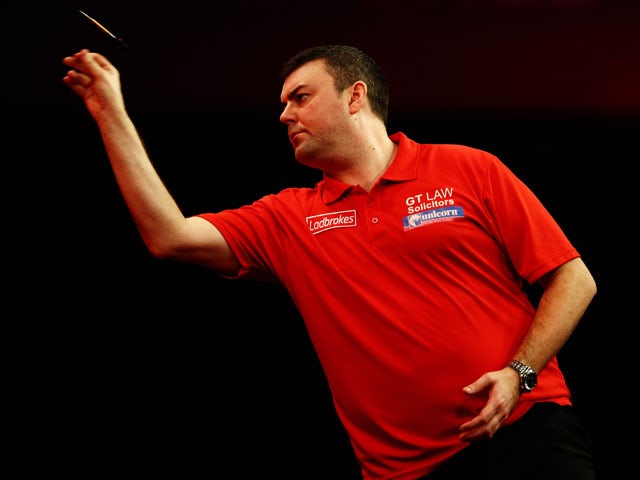 Wes Newton of England throws a dart during the quarter final match between Wes Newton of England and James Wade of England on day thirteen of the 2013 Ladbrokes.com World Darts Championship at Alexandra Palace on December 29, 2012