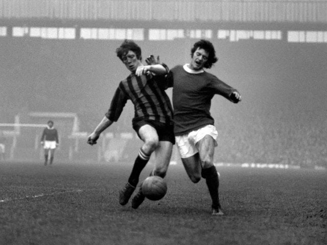 Willie Morgan in action for Manchester United.
