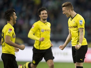 Reus gives Dortmund half-time lead