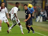 Yuto Nagatomo of FC Inter Milan and Ibrahima Mbaye of AS Livorno Calcio compete for the ball during the Serie A match on November 9, 2013