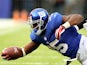 Andre Brown of the New York Giants tries to get an extra yard as he is tackled by Kevin Burnett of the Oakland Raiders at MetLife Stadium on November 10, 2013