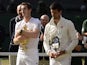 Andy Murray and Novak Djokovic stand with their trophies after the Scot won Wimbledon on July 07, 2013.