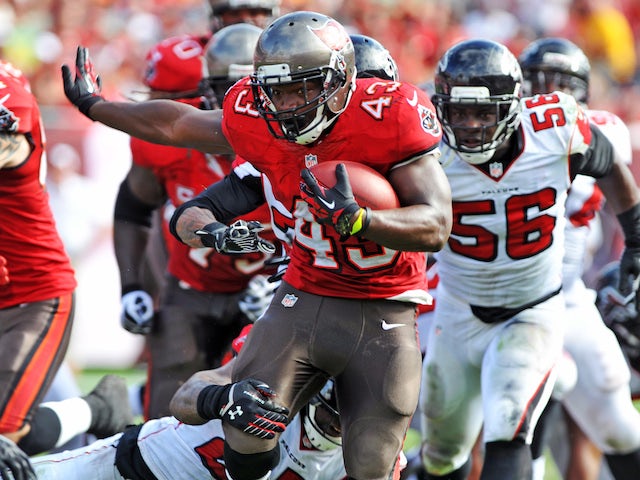 Running back Bobby Rainey of the Tampa Bay Buccaneers runs for a gain in the 2nd quarter against the Atlanta Falcons November 17, 2013