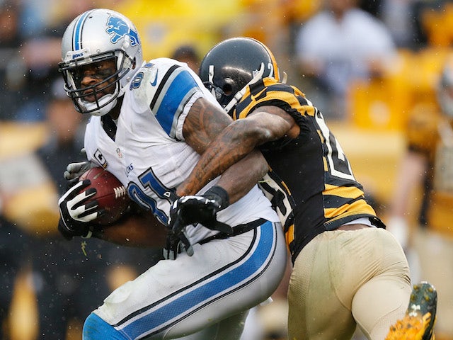Calvin Johnson of the Detroit Lions breaks a tackle by Ike Taylor of the Pittsburgh Steelers and then runs for a second quarter touchdown at Heinz Field on NovembCalvin Johnson #81 of the Detroit Lions breaks a tackle by Ike Taylor #24 of the Pittsburgh S