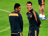 Real Madrid's forward Cristiano Ronaldo of Portugal speaks with Madrid's midfielder Casemiro of Brazil during a training session on the eve of the UEFA Champions League football match Juventus vs Real Madrid at 'Juventus Stadium' in Turin on November 4, 2