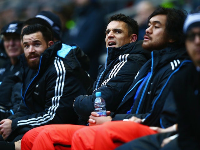 Dan Carter of New Zealand sits injured on the bench during the QBE International match between England and New Zealand at Twickenham Stadium on November 16, 2013