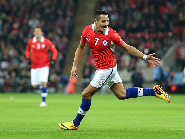 Alexis Sanchez of Chile celebrates after scoring the opening goal during the international friendly match between England and Chile at Wembley Stadium on November 15, 2013