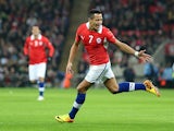 Alexis Sanchez of Chile celebrates after scoring the opening goal during the international friendly match between England and Chile at Wembley Stadium on November 15, 2013