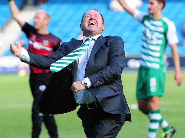 Yeovil Town manager Gary Johnson wildly celebrates the opening day victory over Millwall in the Championship on August 3, 2013