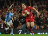 Wales player George North bursts past Horacio Agulla to score the second Wales try during the International Match between Wales and Argentina at the Millennium Stadium on November 16, 2013