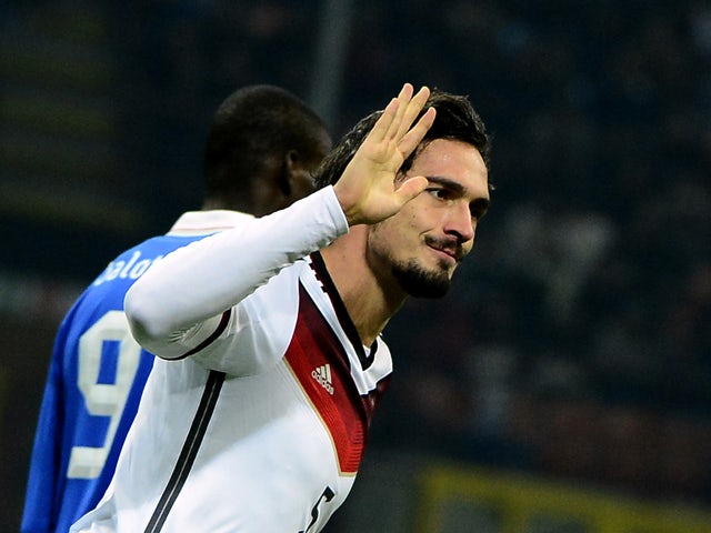 Germany's defender Mats Hummels celebrates after scoring during the FIFA World Cup friendly football match Italy vs Germany on November 15, 2013