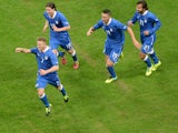 Ignazio Abate of Italy celebrates with team-mates after scoring his team's first goal during the International Friendly match between Italy and Germany at San Siro Stadium on November 15, 2013