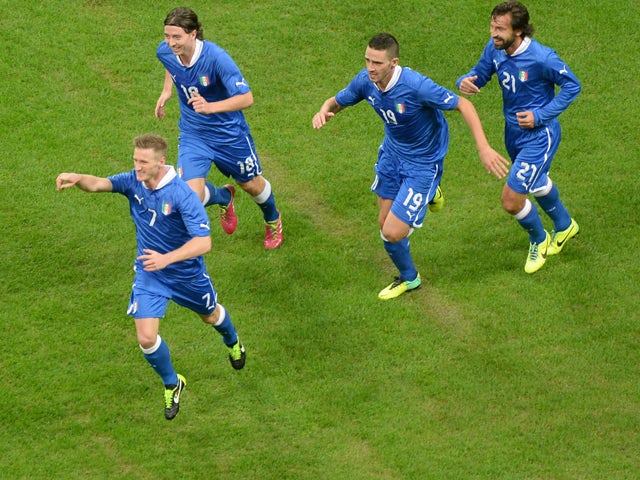 Ignazio Abate of Italy celebrates with team-mates after scoring his team's first goal during the International Friendly match between Italy and Germany at San Siro Stadium on November 15, 2013