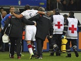 Sami Khedira of Germany is helped off the pitch with an injury during the international friendly match between Italy and Germany at Giuseppe Meazza Stadium on November 15, 2013
