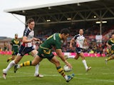Jarryd Hayne of Australia scores a try as Daniel Howard of USA looks on during the Rugby League World Cup Quarter Final match between Australia and USA