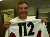 Jason Leonard of England displays a commemorative number 112 jersey after setting a new world record of 112 international apppearances during the Rugby World Cup semi-final against France on November 16, 2013